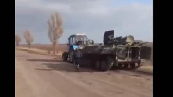Watch|Ukrainian farmer tows Russian tank amid military invasion, see light-hearted video here