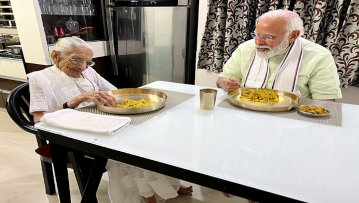 Day after BJP's lanslide win in Assembly polls, PM Modi meets his mother in Gujarat, holds roadshow in Ahmedabad