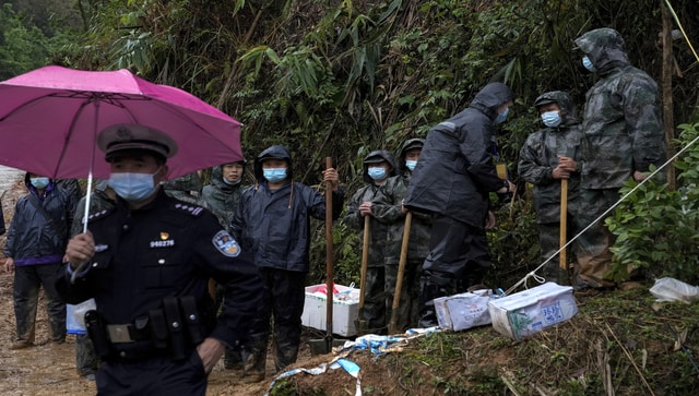 China plane crash: Searchers find wing and engine parts from site of tragedy China plane crash: Searchers find wing and engine parts from site of tragedy