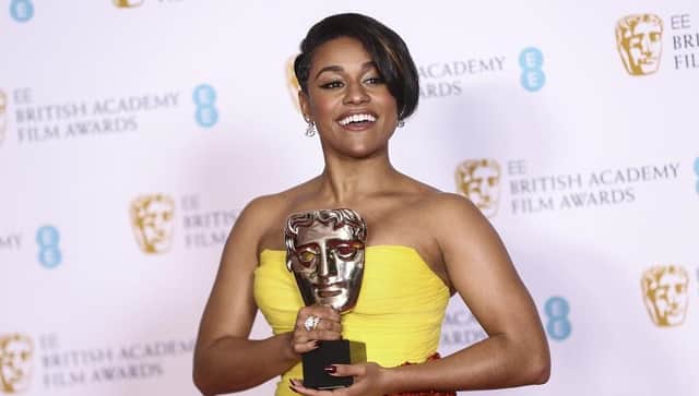 Ariana Debose holds her Supporting Actress award for her role in the film West Side Story at the 75th British Academy Film Awards. The Associated Press