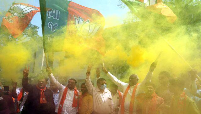 Supporters of BJP celebrate after their party's victory in state elections, in Ahmedabad. AP