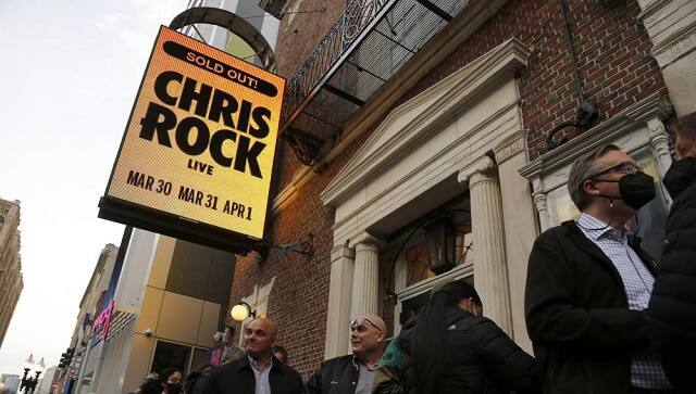 Ticket holders wait to enter the Wilbur Theatre for a performance by Chris Rock, Wednesday, March 30, 2022, in Boston. (AP Photo/Mary Schwalm)