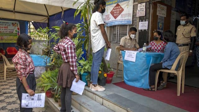 Children wait in line to register themselves for COVID-19 vaccine at a health centre in New Delhi. India has expanded its vaccination drive to include 12-14 year-old children. AP