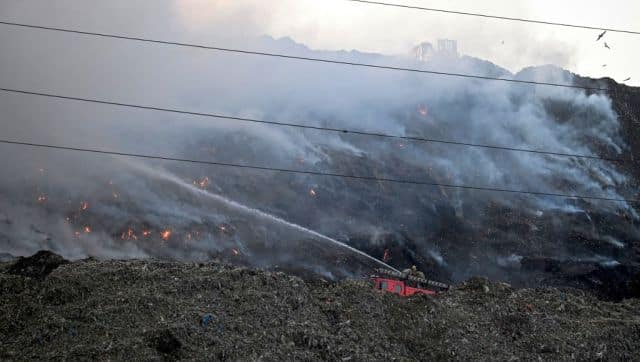 Firemen try to douse a fire that broke out at the Ghazipur landfill on the outskirts of New Delhi. AFP