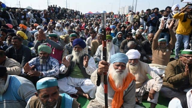 File image of farmers sitting along a blocked highway during a protest against the central government's agricultural reforms at the Delhi-Uttar Pradesh state border in Ghazipur. AFP
