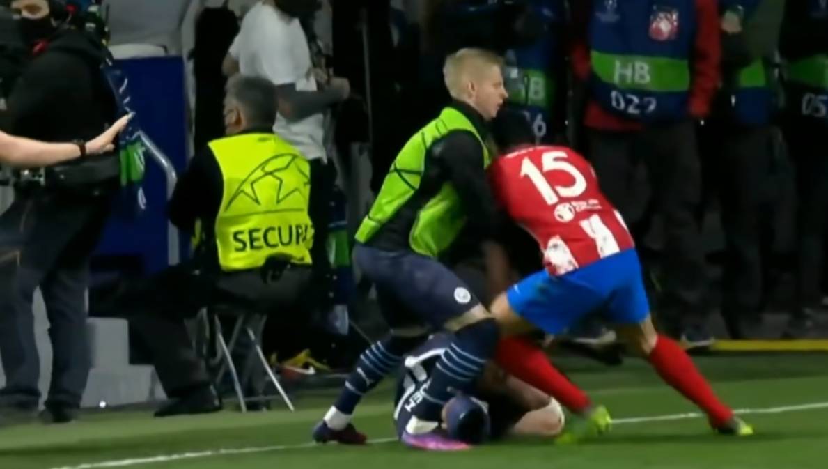 City defender Oleksandr Zinchenko, who was warming up nearby, come in between the two players. Twitter