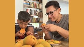 Watch Aamir Khan and son Azad enjoying a mango binge in the summer