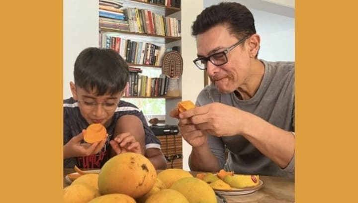 Watch Aamir Khan and son Azad enjoying a mango binge in the summer