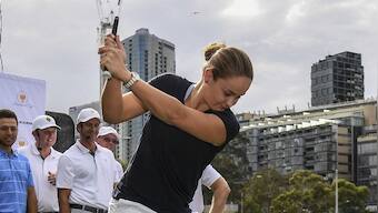 Ashleigh Barty swings back into action, trades tennis for golf