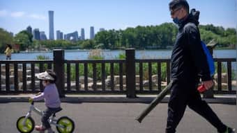 Beijing tightens COVID-19 restrictions as long holiday begins