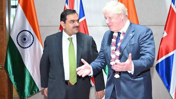 Boris Johnson meets industrialist Gautam Adani in Ahmedabad, tries hands on 'charkha' in Sabarmati Ashram