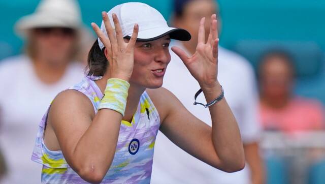 Iga Swiatek of Poland reacts after beating Naomi Osaka of Japan, 6-4, 6-0, during the women’s singles finals of the Miami Open tennis tournament, Saturday, April 2, 2022, in Miami Gardens, Fla. (AP Photo/Wilfredo Lee)