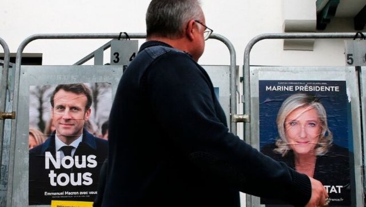 Emmanuel Macron confident of winning presidential election as far-right rival Marine Le Pen narrows gap in opinion polls