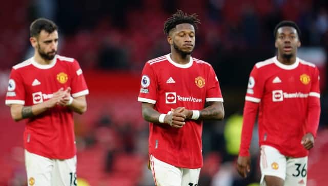 Manchester United's Bruno Fernandes, Fred and Anthony Elanga, from left, leave the field at the end of the English Premier League soccer match between Manchester United and Leicester City at Old Trafford in Manchester, England, Saturday, April 2, 2022. The game ended in a 1-1 draw. (AP Photo/Jon Super)