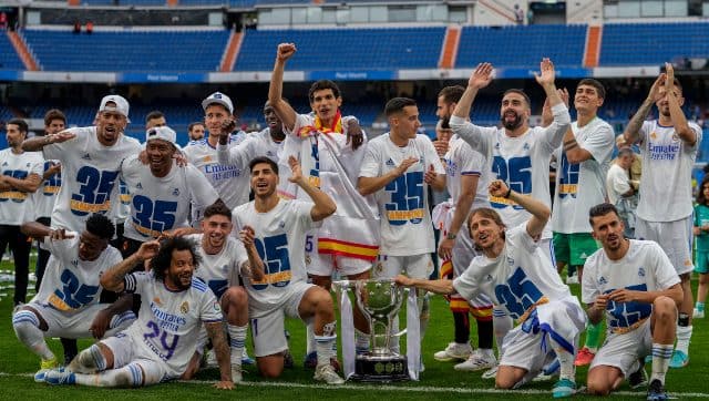 Real Madrid players pose with the LaLiga trophy. AP