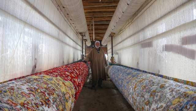 Around 60 artisans from Kashmir are weaving over a 275-square-metre-long hand-woven carpet at Wailoo, Pattan area of North Kashmir in Baramulla district