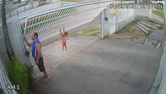 Watch: Little girl with 'vice-like grip' clings to gate as it rises; here's how users reacted to hilarious clip