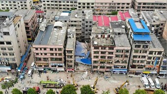 Two more survivors pulled from collapsed building in China, dozens feared missing
