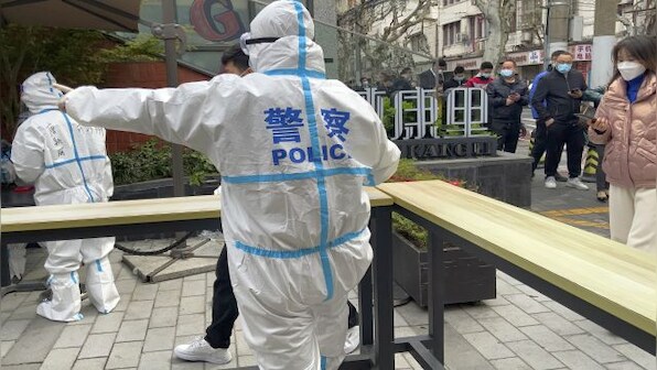China's health system feels the pressure as Omicron cases spike