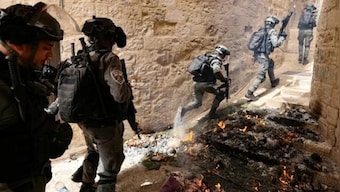 Israel carries out its first air strike on Gaza Strip after rocket attack as Jerusalem tensions spike