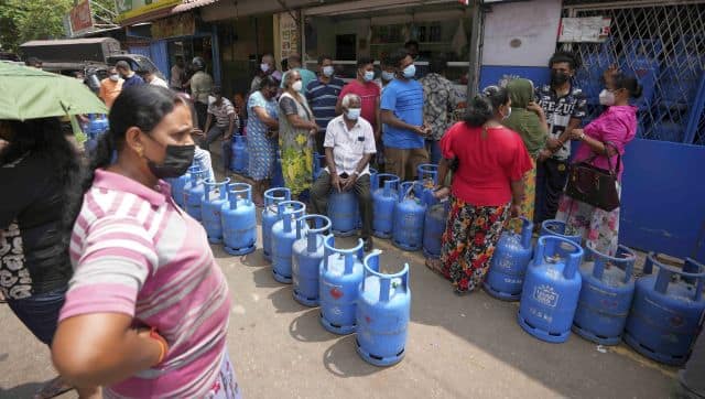 Sri Lankans wait to buy cooking gas at a vendor in Colombo, Sri Lanka. AP