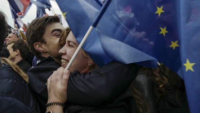 Supporters of French president Emmanuel Macron celebrate in Paris, France. His victory also comes as a big relief to leaders in the West. AP