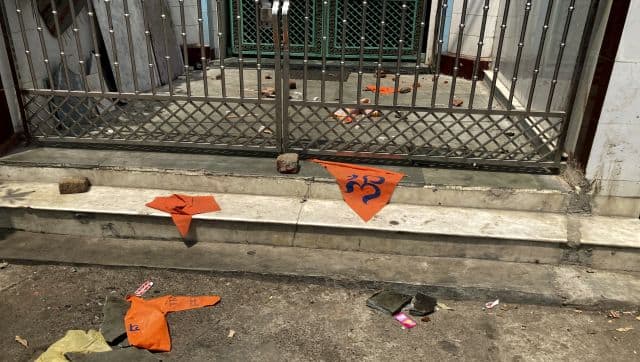 Saffron flags lie outside a mosque a day after communal clashes in Jahangirpuri, a neighbourhood in northwest Delhi. AP