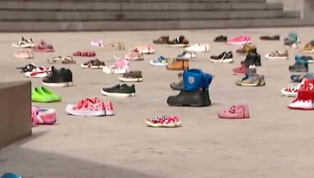 Watch: Georgia activists place 145 pairs of shoes outside parliament to honour kids who died in Ukraine war Watch: Georgia activists place 145 pairs of shoes outside parliament to honour kids who died in Ukraine war