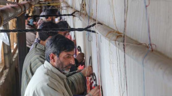 In Kashmir, artisans knit Asia's biggest carpet, spark hope for Qaleen tradition