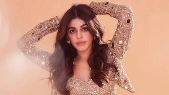 Here's a picture of Alaya F holding iced coffee to brighten your day