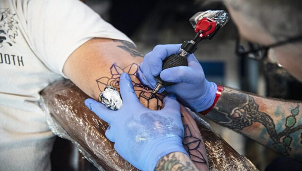 A tattoo shop’s artist said 70 per cent of the proceeds from patriotic tattoos will go to the Ukrainian army. AP/File