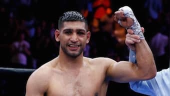 'Time to hang up my gloves': British boxing star Amir Khan announces retirement