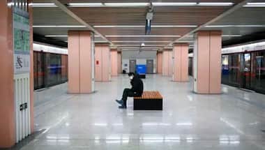 Beijing closes subway stations to restrict movement amid spike in COVID-19 cases