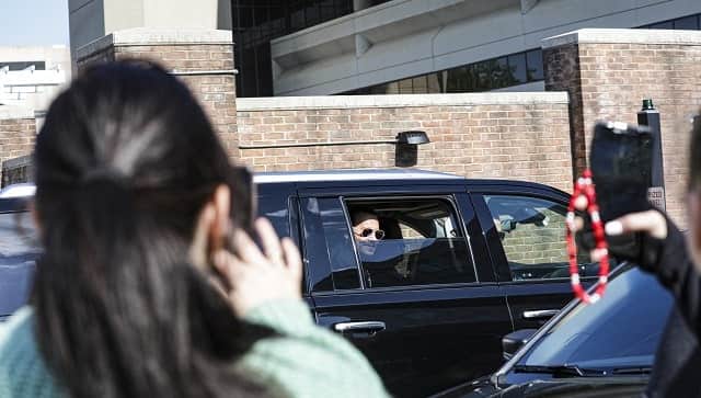 Fans of Johnny Depp take photos of the actor as he arrives for trial in Fairfax, Virginia, April 27, 2022. (Valerie Plesch/The New York Times)