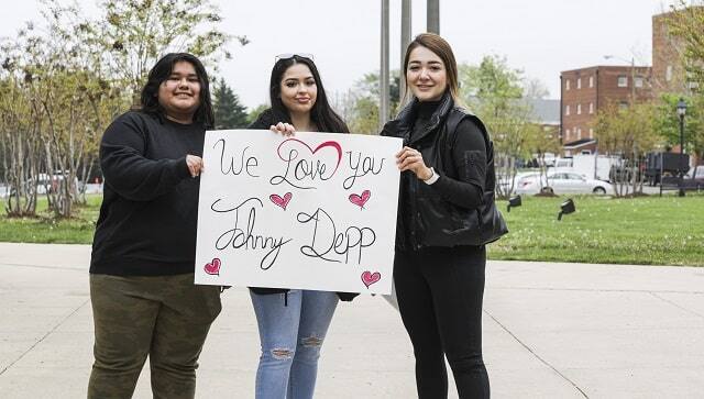 From left, Ines Sorto-Rojas, Kailyn Diaz, and Anasofia Almanac show their support for actor Johnny Depp outside the courthouse in Fairfax, Virginia, April 25, 2022. (Valerie Plesch/The New York Times)