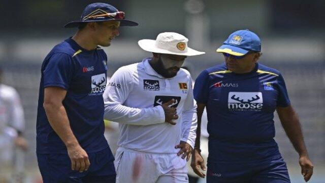 Sri Lanka’s Kusal Mendis (centre) walks back to the pavilion after an injury during the first day of the second Test between Bangladesh and Sri Lanka at the Sher-e-Bangla National Cricket Stadium in Dhaka on Monday. AFP