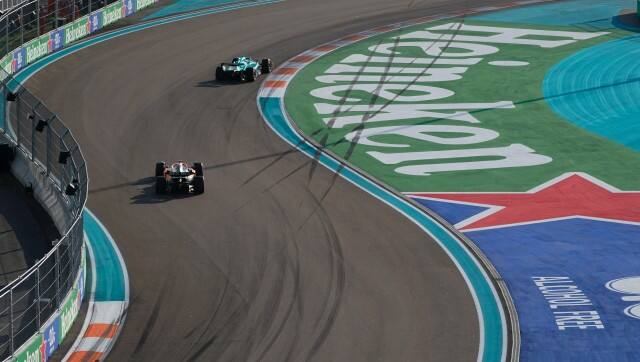 McLaren driver Daniel Ricciardo of Australia and Aston Martin driver Lance Stroll of Canada drive around the circuit during the second practice session for the Formula One Miami Grand Prix auto race at the Miami International Autodrome, Friday, May 6, 2022, in Miami Gardens, Fla. (AP Photo/Darron Cummings)
