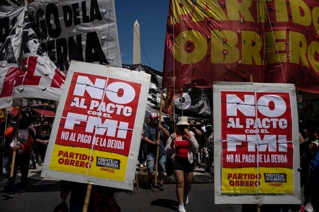 People protest against the government's decision to reach an agreement with the International Monetary Fund, in Buenos Aires, Argentina, 27 January, 2022. AP