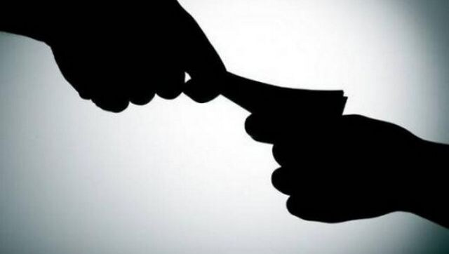 Punjab man caught chewing bribe notes during meter reading, terminated from service Punjab man caught chewing bribe notes during meter reading, terminated from service