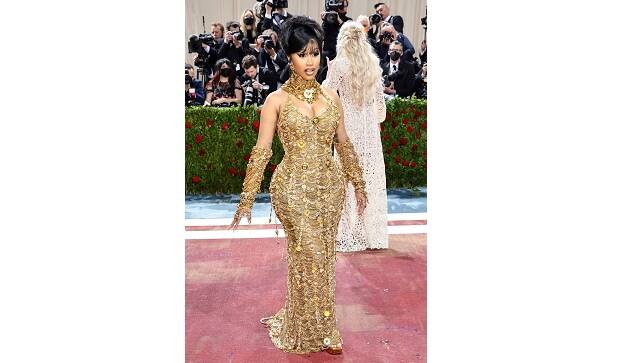 Cardi B attended Met Gala 2022 dripping with gold chains | Image from Getty