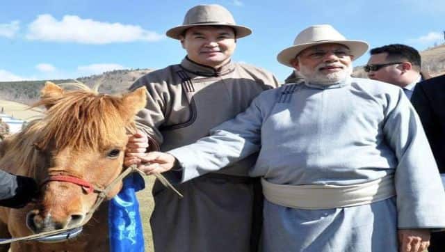 Prime Minister Narendra Modi turned heads with this white fedora flowing Mongolian robe in Ulan Bator. PTI