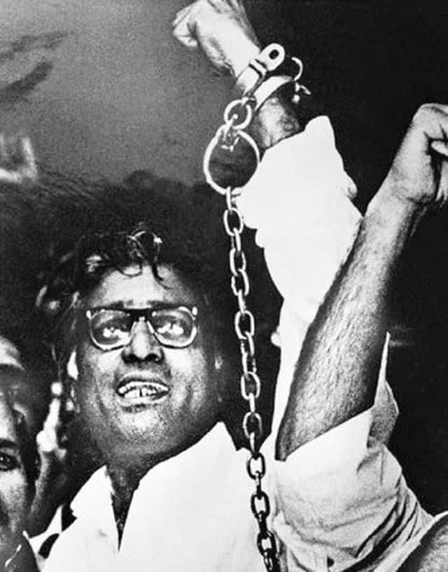George Fernandes in handcuffs raising his hand in defiance is one of the most enduring photographs of the Emergency era. Image Courtesy: www.georgefernades.com