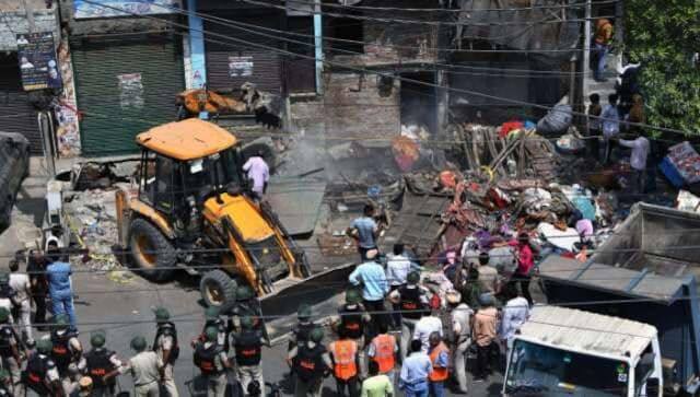Bulldozers used to remove illegal structures during anti-encroachment drive in Delhi's Jahangirpuri. ANI