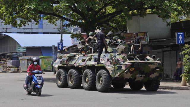 Sri Lankan soldiers patrol during curfew in Colombo. The military has denied rumours of a coup. AP