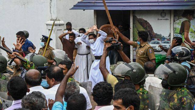 Demonstrators and government supporters clash outside the official residence of Mahinda Rajapaksa, in Colombo. AFP