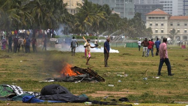 Sri Lanka's pro- government supporters vandalise the camps of anti- government protestors outside the president's office in Colombo, Sri Lanka. AP