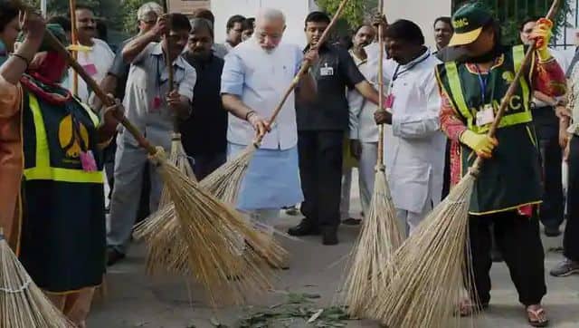 The image of Narendra Modi sweeping the streets is one of his most popular photographs during his time in office. PTI