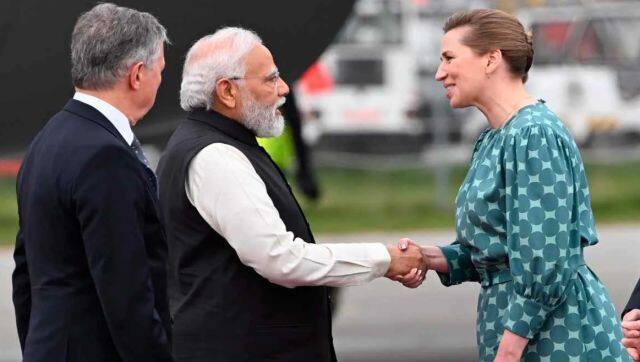 PM Modi is welcomed by his Danish counterpart Mette Frederiksen. PTI