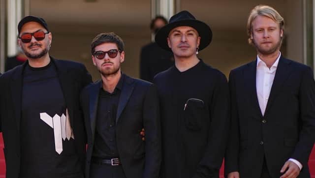 Director Kirill Serebrennikov, from left, Filipp Avdeyev, Oxxxymiron, and lya Stewart pose for photographers upon arrival at the premiere of the film ‘Tchaikovsky’s Wife’ at the 75th international film festival, Cannes, southern France, Wednesday, May 18, 2022. (AP Photo/Daniel Cole)