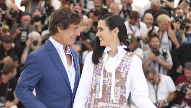 Tom Cruise, left, and Jennifer Connelly pose for photographers at the photo call for the film 'Top Gun: Maverick' at the 75th international film festival, Cannes, southern France, Wednesday, May 18, 2022. (Photo by Vianney Le Caer/Invision/AP)